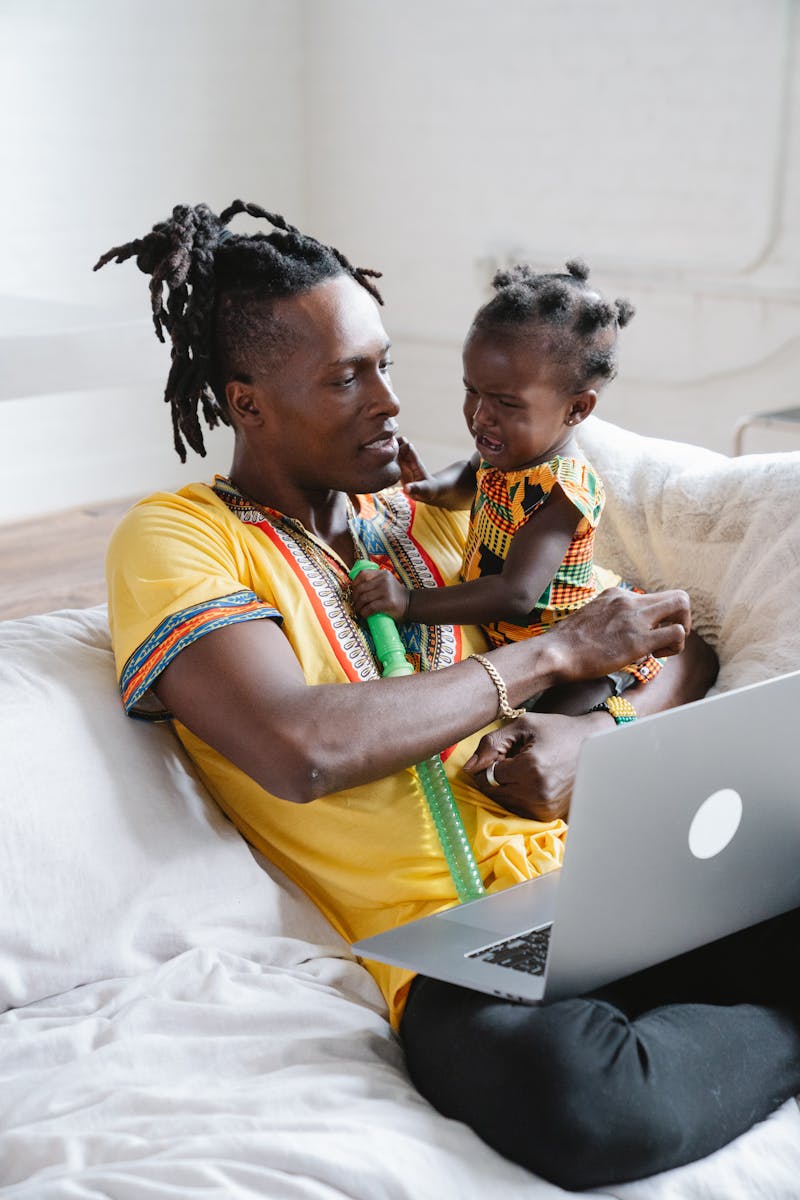 Father comforting his toddler